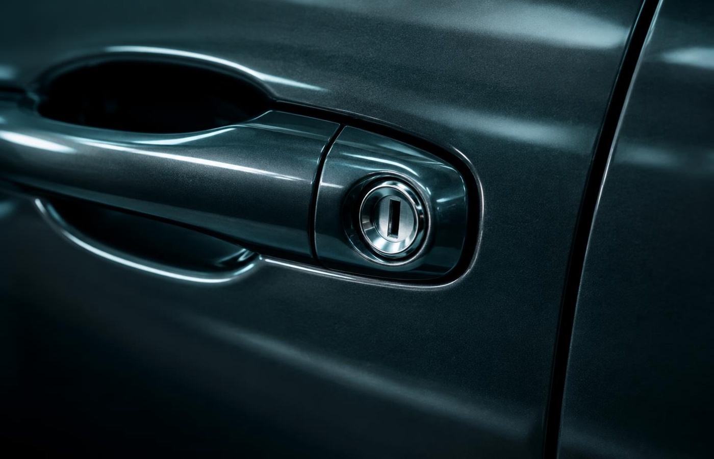 Close-up of a car door lock and keyhole